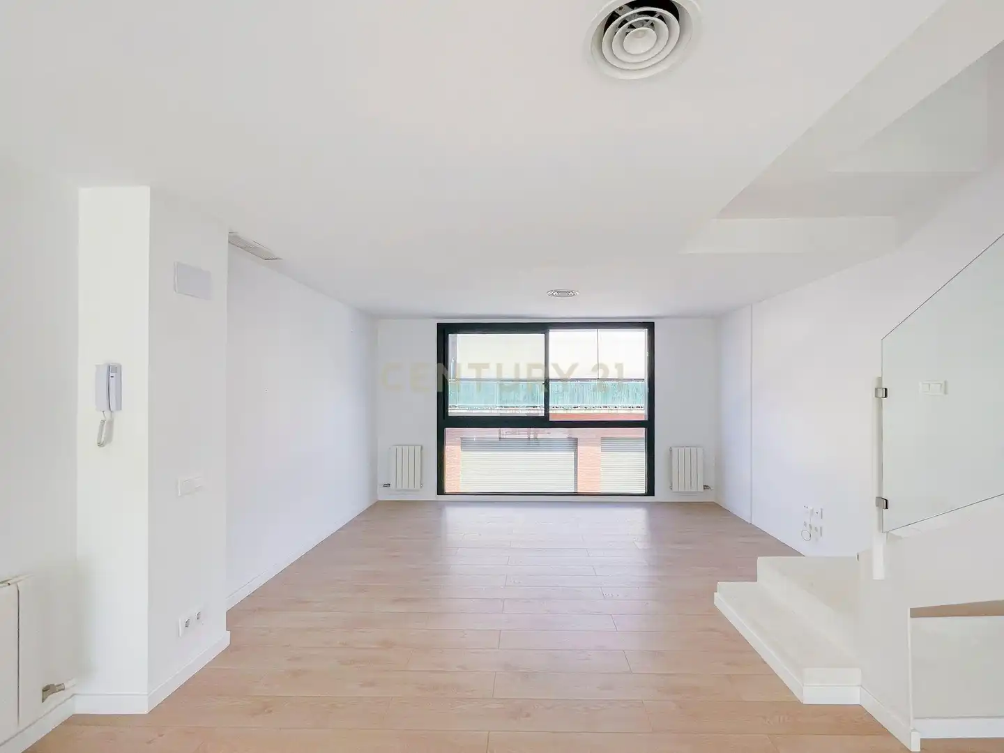 Sala d'estar de Casa adosada en venda en Hostalric