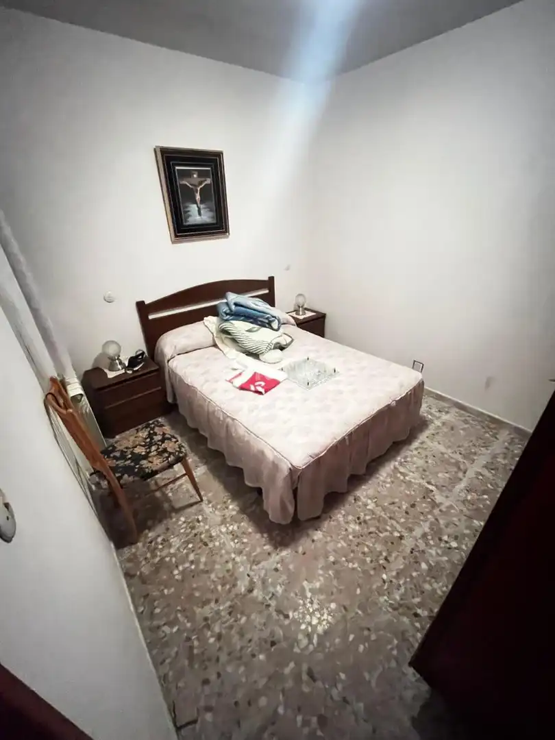 Habitación de Casa adosada en venta en Puertollano con Calefacción