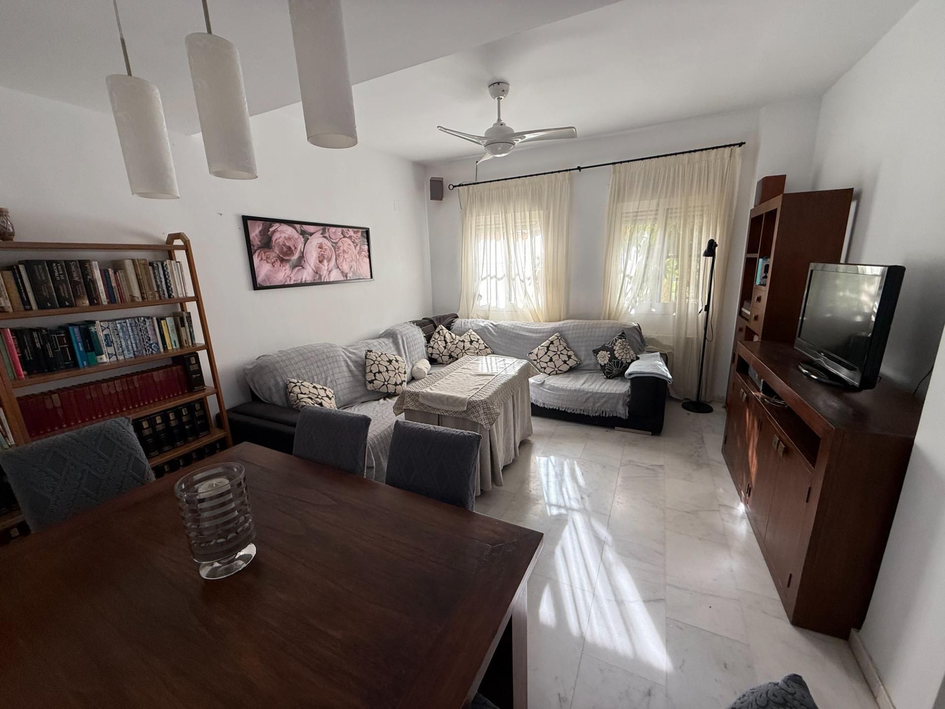 Living room of Single-family semi-detached for sale in Sanlúcar la Mayor  with Air Conditioner, Private garden and Terrace