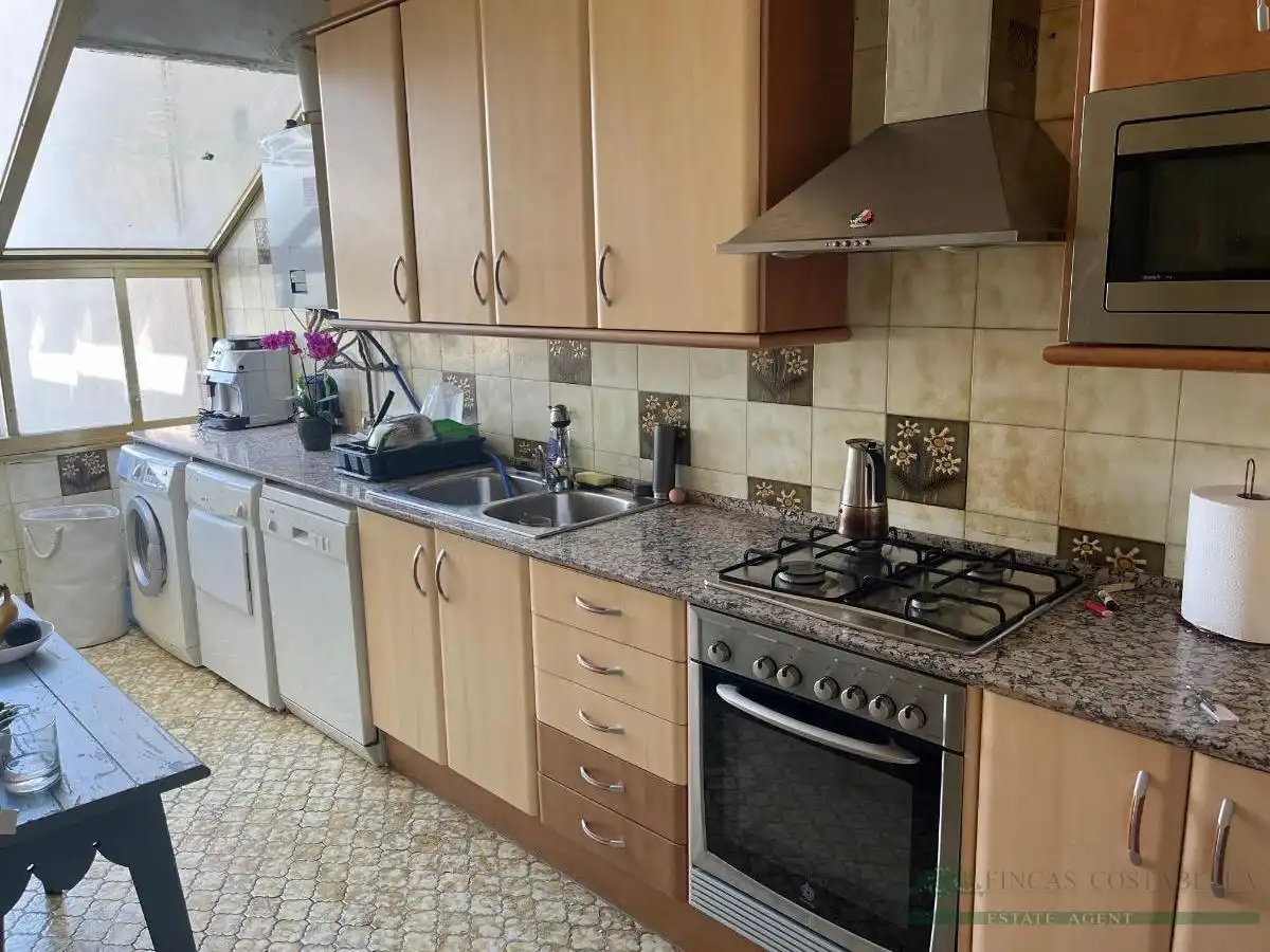 Cuina de Apartament en venda en Sant Feliu de Guíxols amb Calefacció, Terrassa i Piscina comunitària