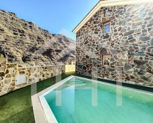 Exterior view of House or chalet for sale in Mogán  with Air Conditioner and Terrace