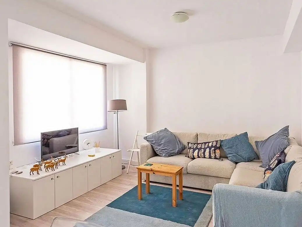 Sala de estar de Apartamento para compartir en Huelva con Aire acondicionado y Amueblado