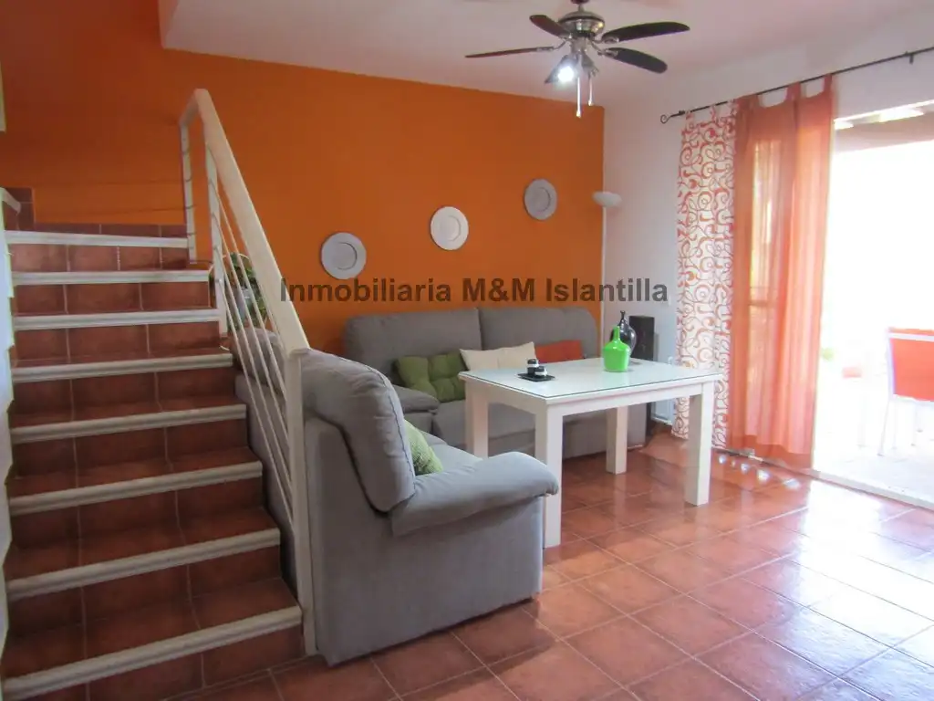 Sala de estar de Casa adosada en venta en Islantilla con Jardín privado, Terraza y Amueblado