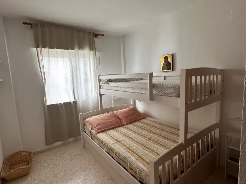 Habitación de Apartamento de alquiler en El Portil con Jardín privado, Terraza y Piscina