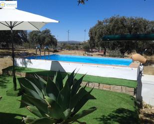 Swimming pool of Country house for sale in El Ronquillo  with Air Conditioner and Terrace