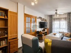 Sala de estar de Casa adosada en venta en Vegas del Genil con Aire acondicionado, Calefacción y Jardín privado