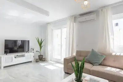 Sala de estar de Casa adosada en venta en Benalmádena con Aire acondicionado, Calefacción y Jardín privado