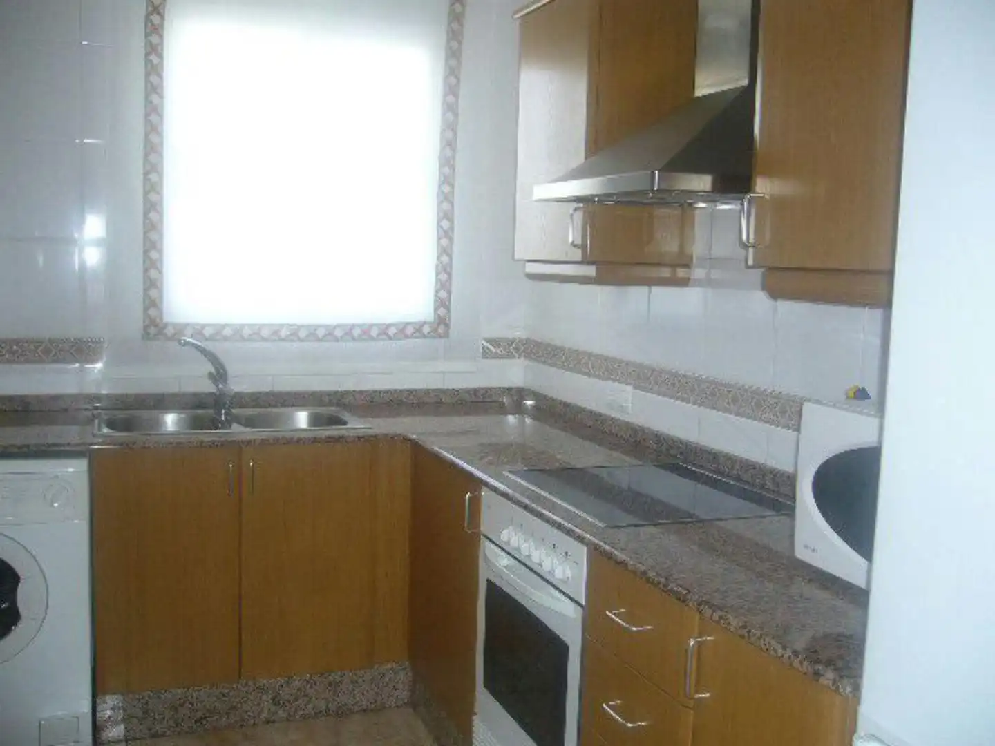 Cuina de Apartament de lloguer en Dénia amb Aire condicionat, Terrassa i Moblat