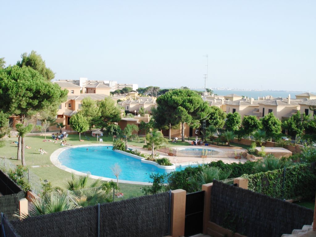 Piscina de Dúplex de lloguer en El Puerto de Santa María amb Jardí privat, Terrassa i Piscina comunitària