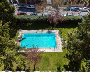 Swimming pool of Attic for sale in  Madrid Capital  with Air Conditioner, Heating and Parquet flooring