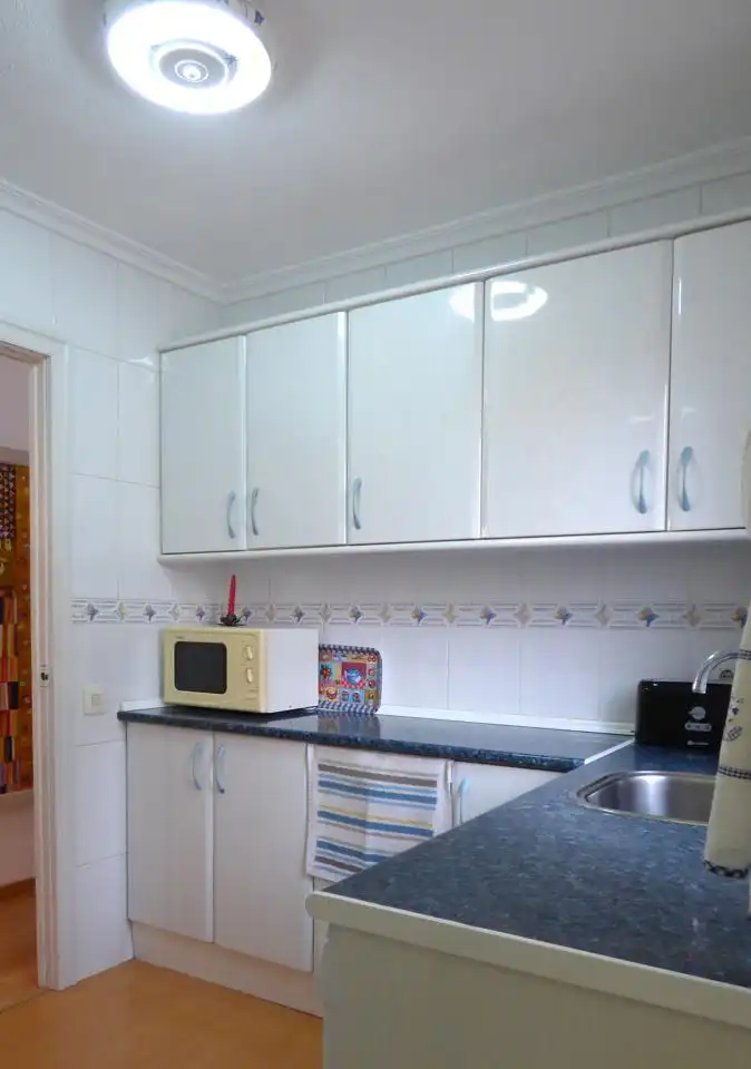 Kitchen of Flat for sale in Benidorm  with Air Conditioner, Furnished and Community pool