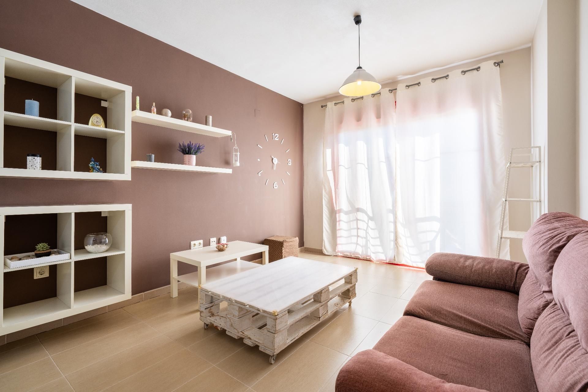 Living room of Flat for sale in  Almería Capital  with Air Conditioner, Private garden and Storage room