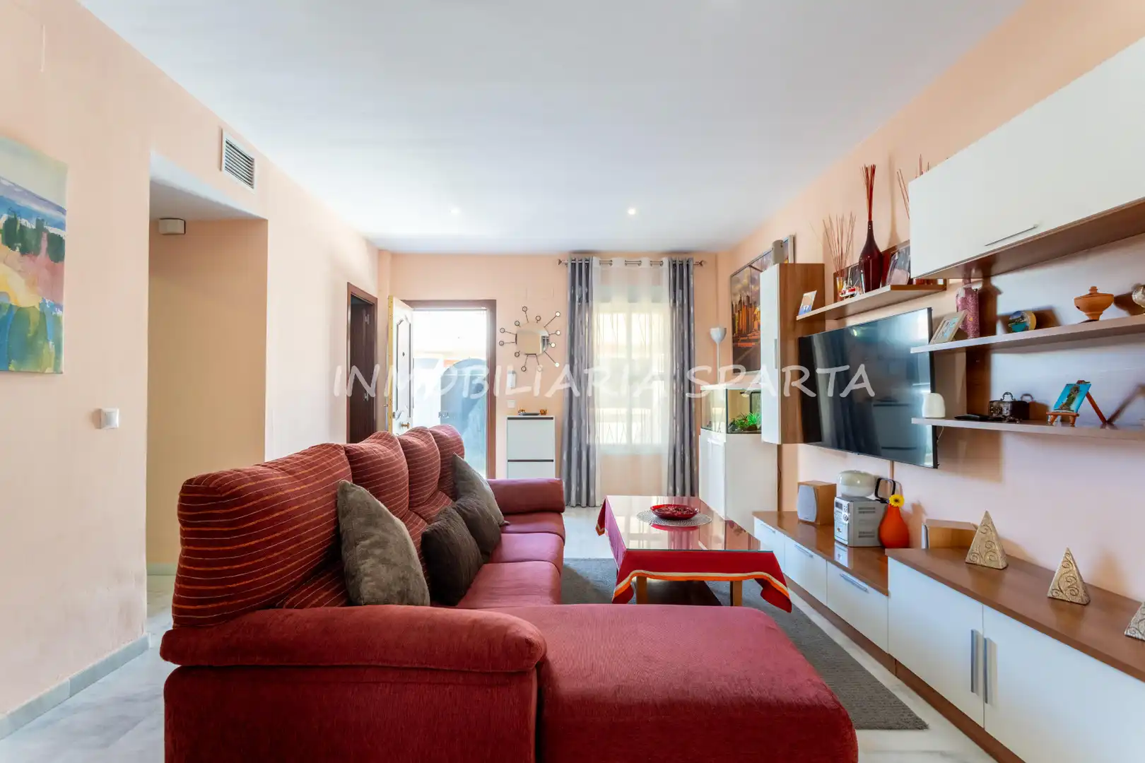 Sala de estar de Casa adosada en venta en Villanueva del Ariscal con Aire acondicionado, Calefacción y Jardín privado