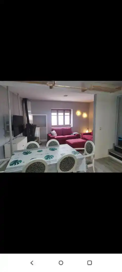Sala d'estar de Casa adosada de lloguer en Villar del Arzobispo amb Aire condicionat, Parquet i Moblat