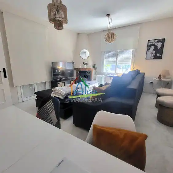 Sala de estar de Casa adosada en venta en Almonte con Aire acondicionado, Calefacción y Jardín privado