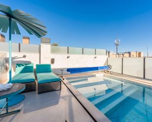 Swimming pool of Duplex for sale in  Madrid Capital  with Air Conditioner, Heating and Furnished