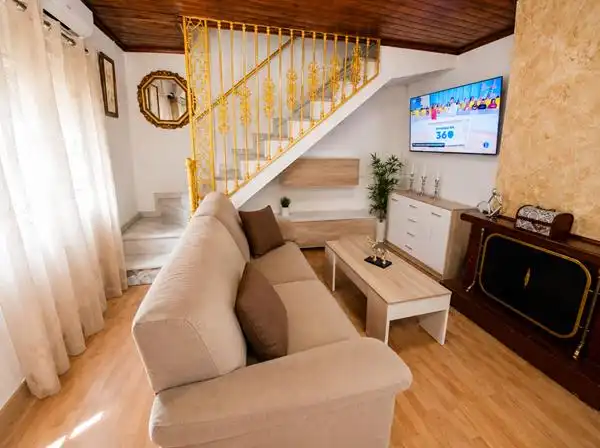 Sala de estar de Casa adosada en venta en Manilva con Aire acondicionado, Calefacción y Terraza