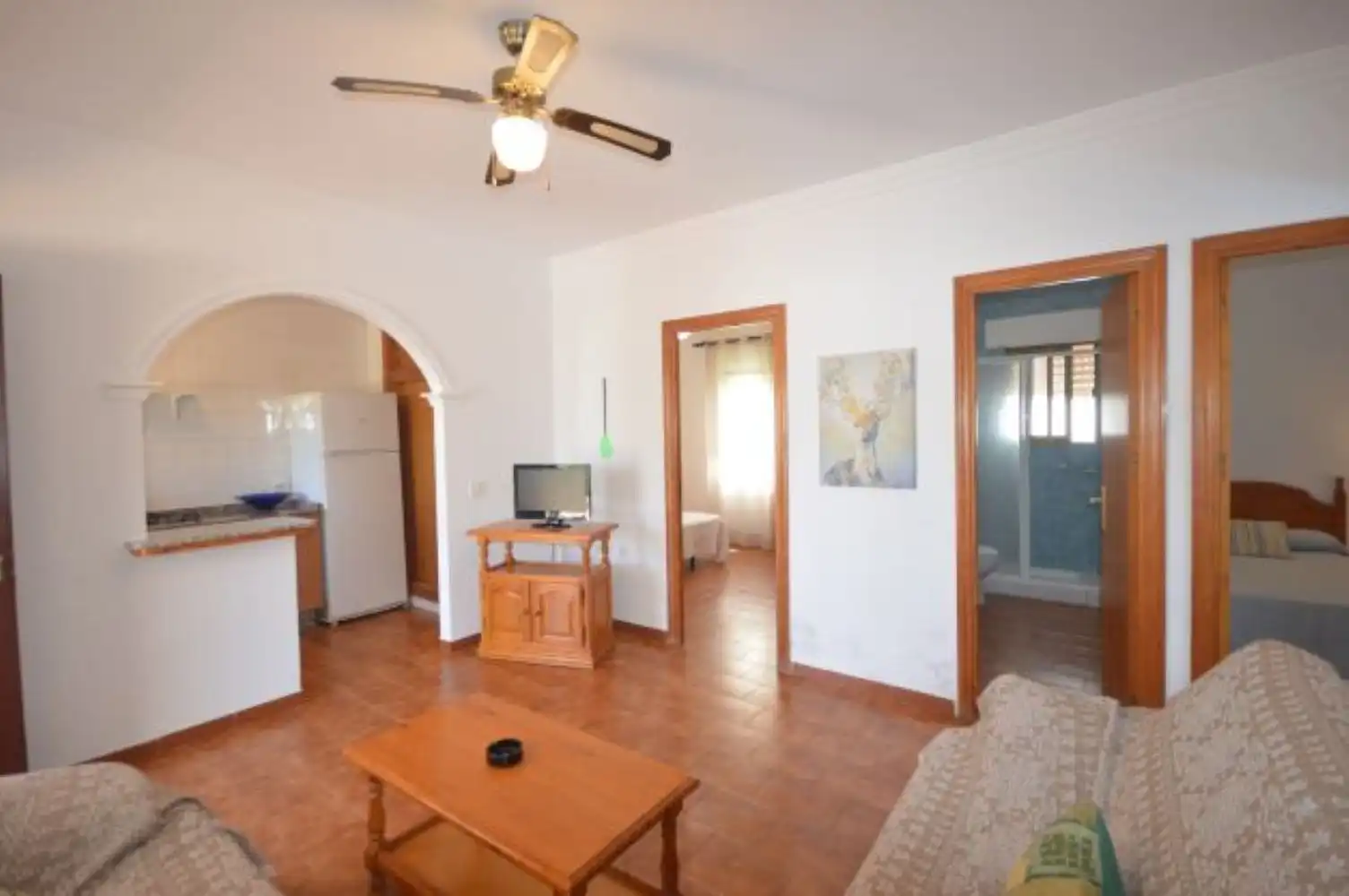 Sala d'estar de Casa adosada de lloguer en Conil de la Frontera amb Aire condicionat, Terrassa i Piscina
