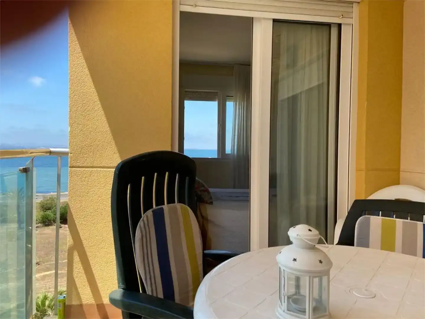 Terrassa de Pis de lloguer en La Manga del Mar Menor amb Aire condicionat, Jardí privat i Piscina