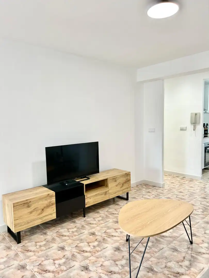 Sala d'estar de Apartament de lloguer en La Pobla de Farnals amb Aire condicionat, Terrassa i Moblat