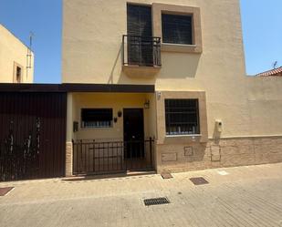 Exterior view of Single-family semi-detached for sale in Puebla de Guzmán  with Terrace, Storage room and Community pool
