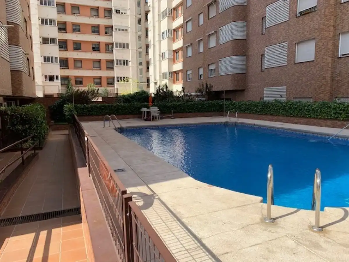 Swimming pool of Flat for sale in  Madrid Capital  with Heating, Private garden and Parquet flooring