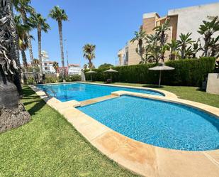 Swimming pool of Single-family semi-detached for sale in El Campello  with Air Conditioner, Terrace and Balcony