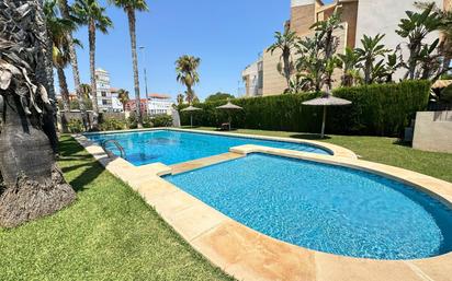 Swimming pool of Single-family semi-detached for sale in El Campello  with Air Conditioner, Terrace and Balcony