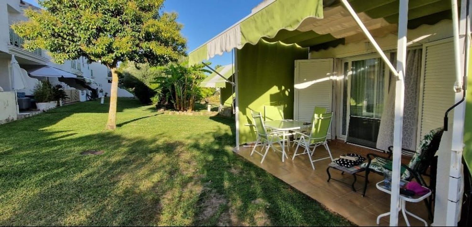 Jardí de Casa adosada de lloguer en El Portil amb Aire condicionat i Calefacció