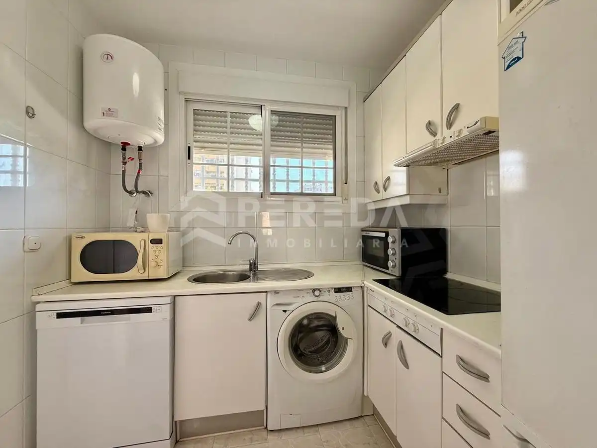 Cocina de Apartamento en venta en Roquetas de Mar con Aire acondicionado, Jardín privado y Amueblado