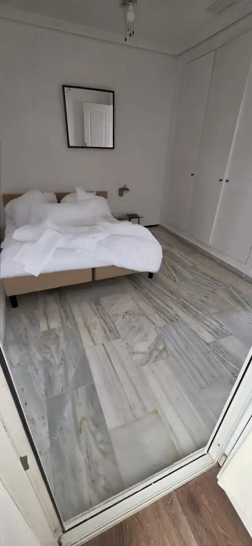Dormitori de Apartament de lloguer en Benalmádena amb Terrassa i Piscina comunitària