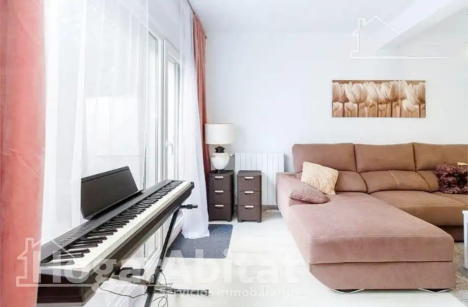 Sala d'estar de Casa adosada en venda en Pedreguer amb Aire condicionat, Jardí privat i Terrassa