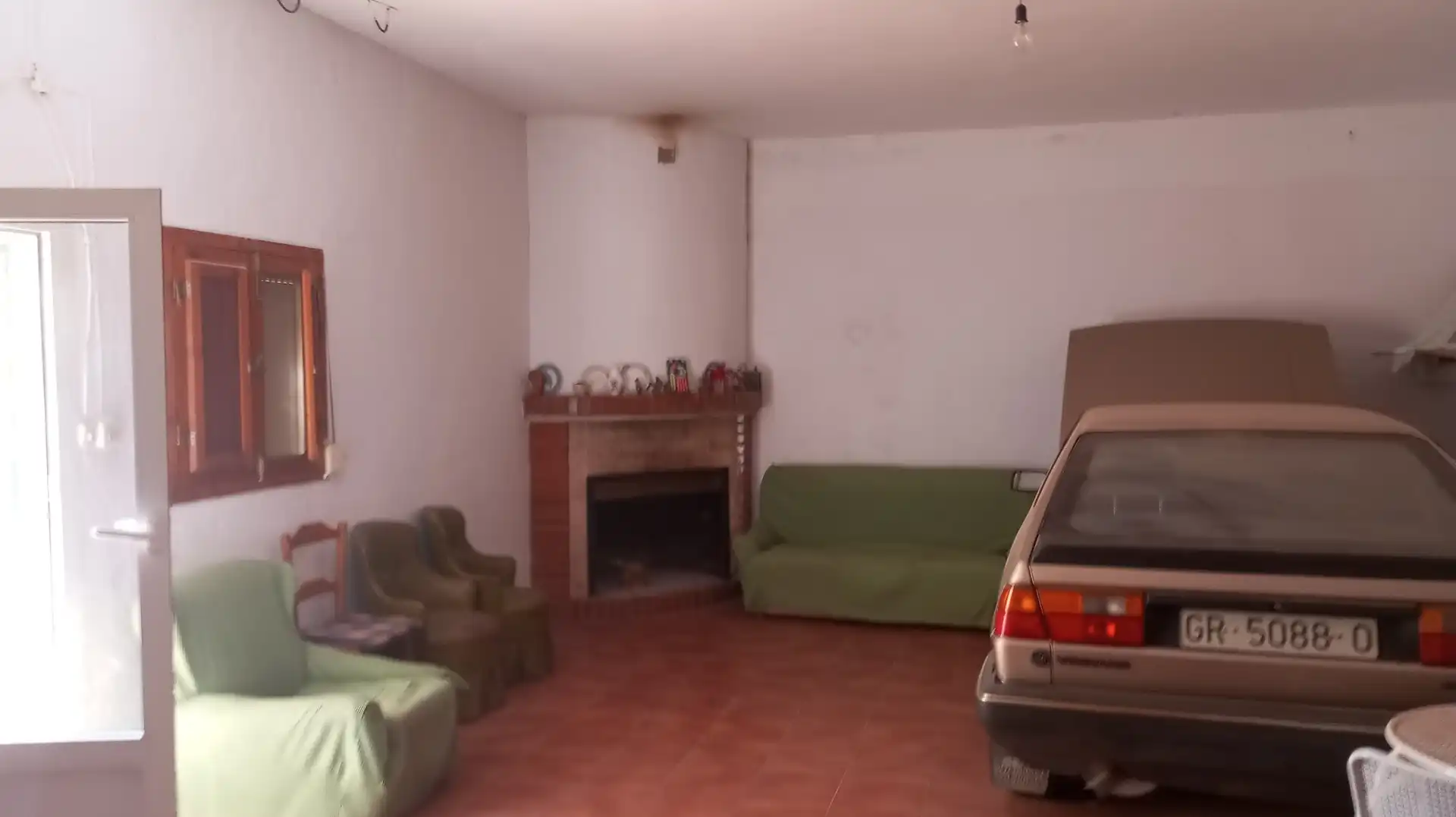 Sala d'estar de Casa o xalet en venda en Baza amb Moblat