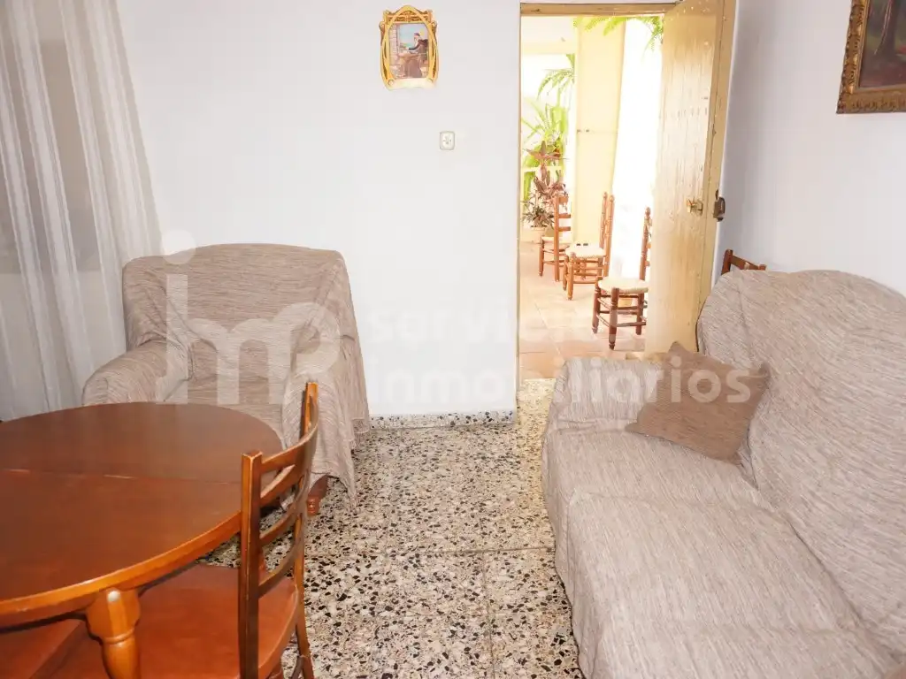 Sala de estar de Casa adosada en venta en Benamocarra con Jardín privado, Terraza y Amueblado
