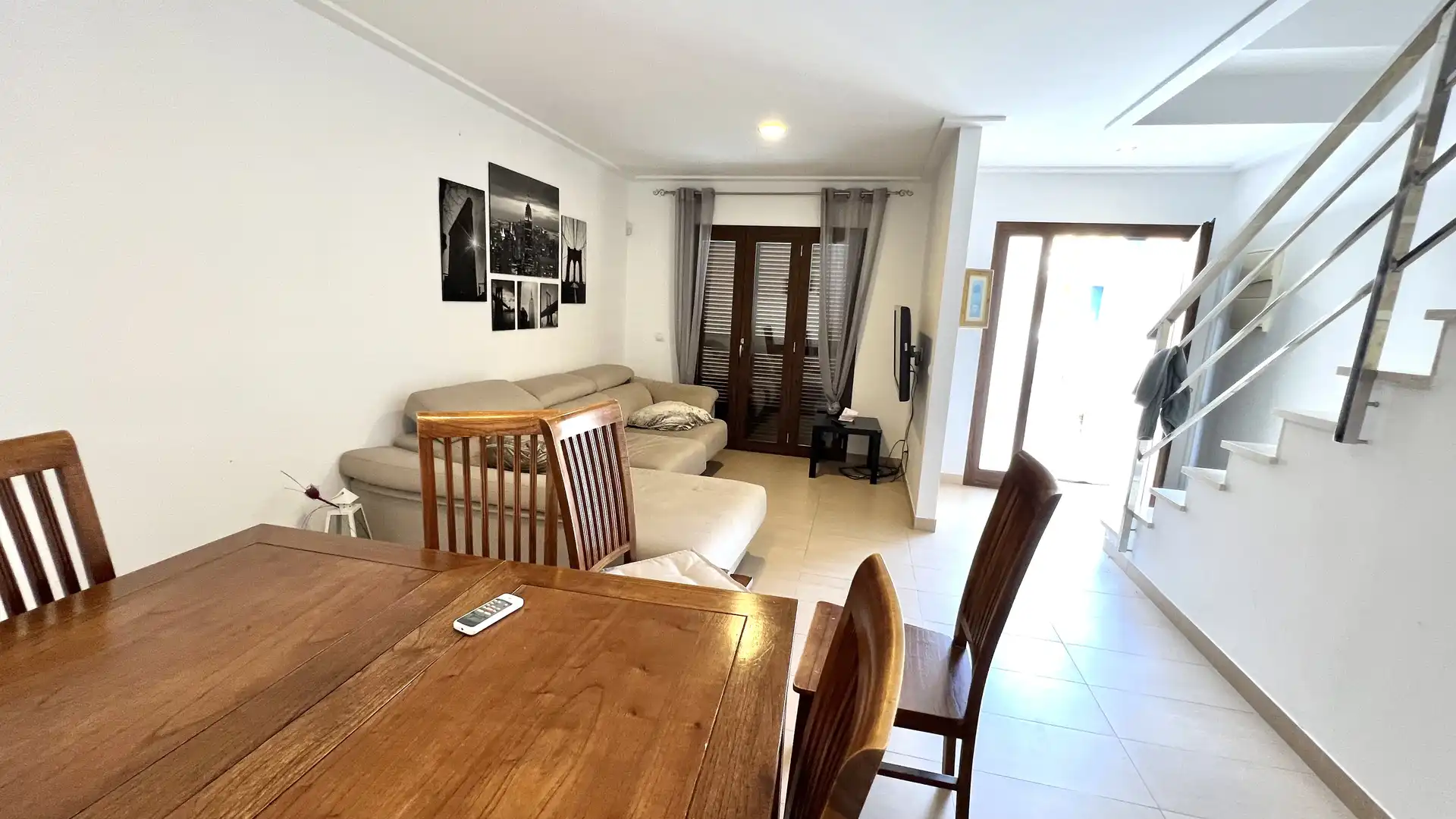 Sala d'estar de Casa adosada en venda en Alcúdia amb Aire condicionat, Terrassa i Moblat