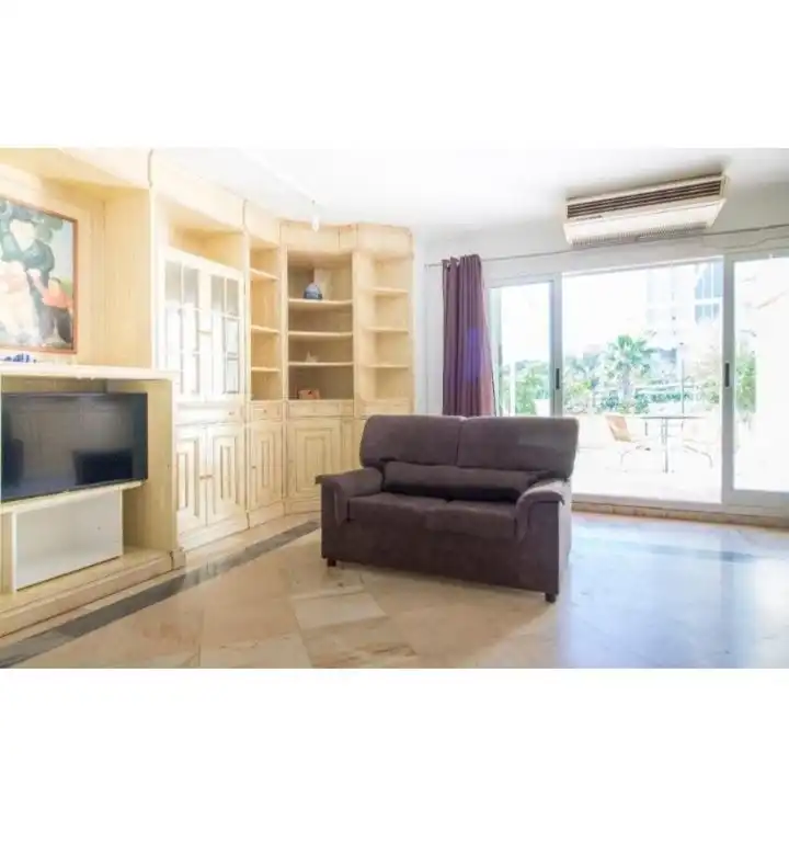 Sala d'estar de Apartament en venda en Benidorm amb Aire condicionat, Terrassa i Moblat