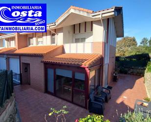 Vista exterior de Casa adosada en venda en Marina de Cudeyo amb Terrassa i Balcó