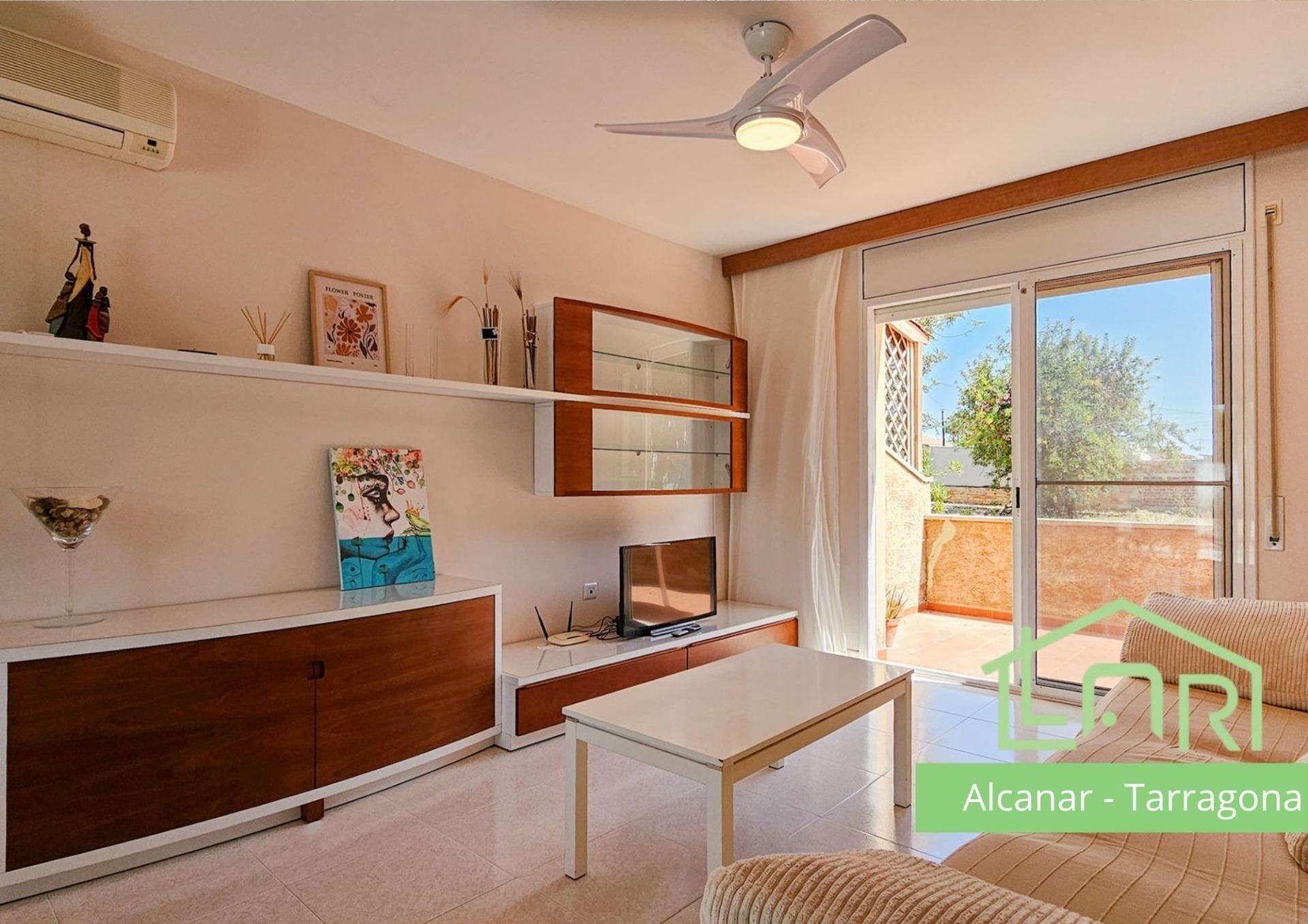 Sala de estar de Casa adosada en venta en Alcanar con Calefacción, Jardín privado y Balcón