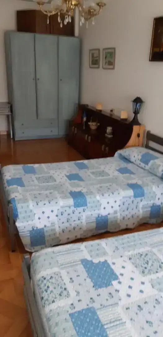 Schlafzimmer von Erdgeschoss zur Miete in Melide mit Privatgarten, Parkett und Möbliert