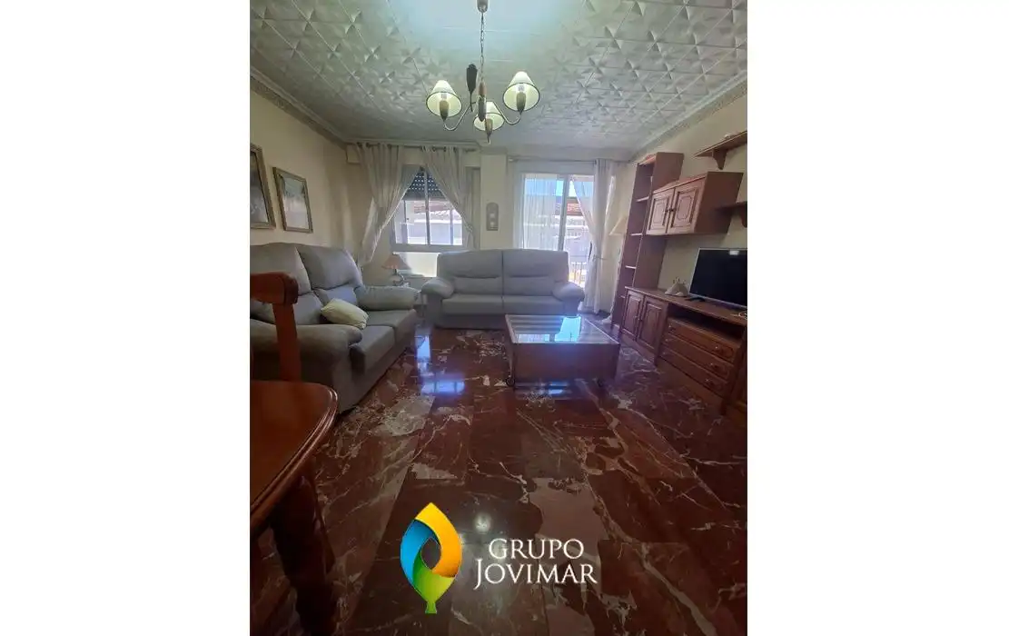 Sala de estar de Piso en venta en Guadix con Calefacción, Terraza y Amueblado