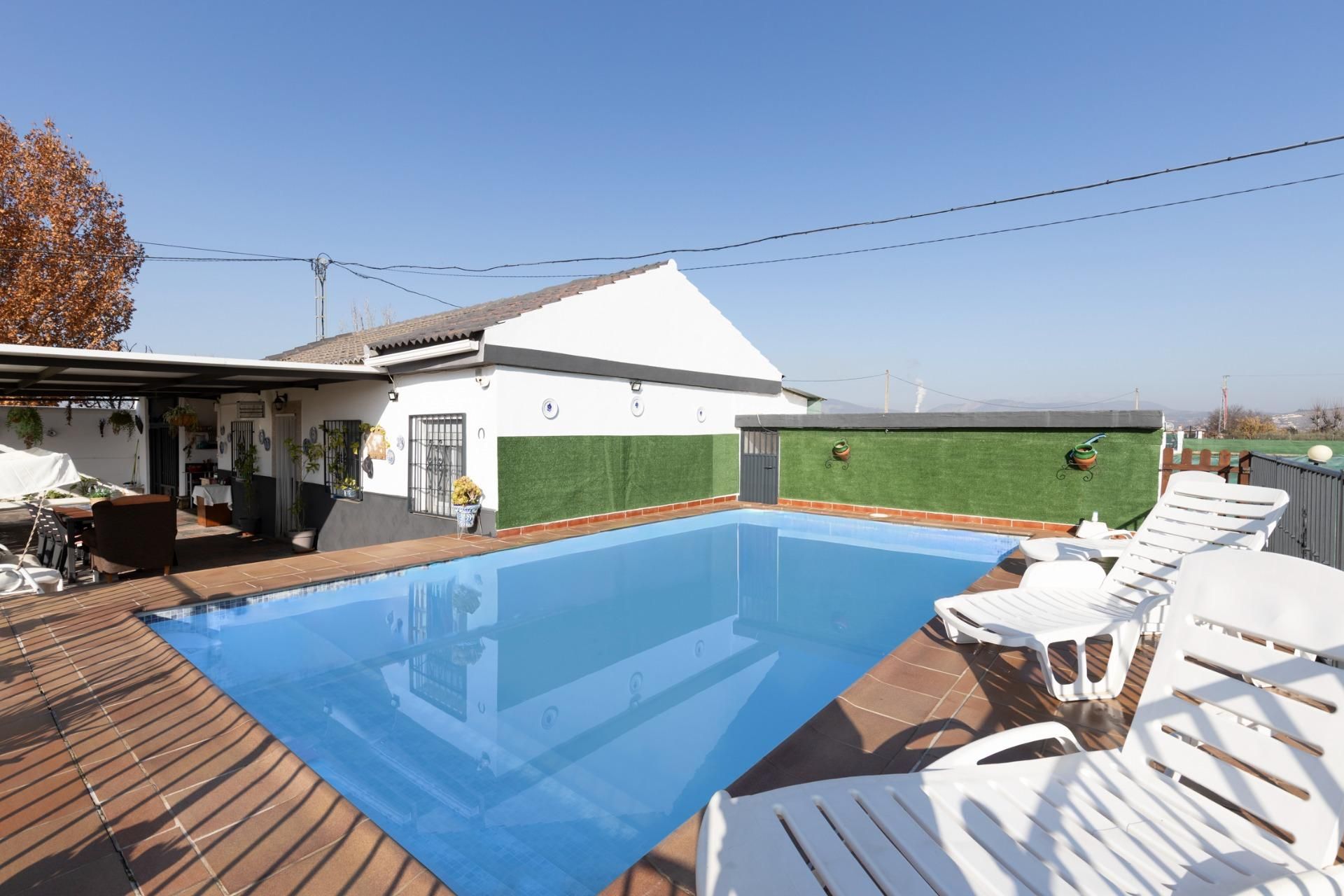 Swimming pool of Country house for sale in Pinos Puente  with Air Conditioner, Private garden and Storage room