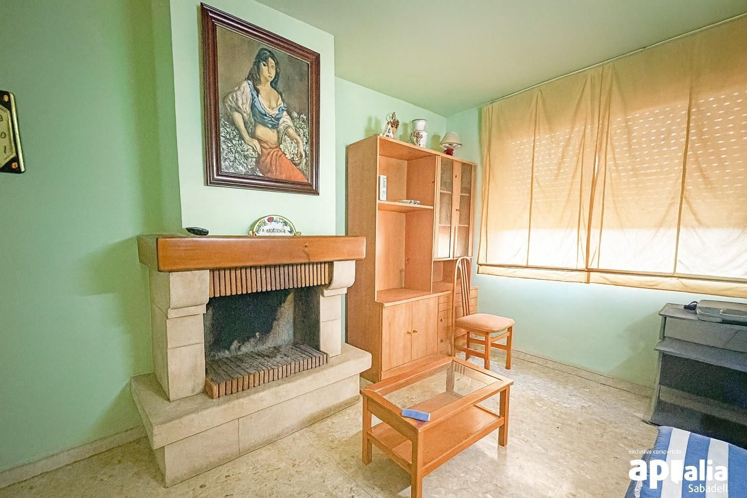 Sala d'estar de Casa adosada en venda en Sabadell amb Calefacció i Terrassa