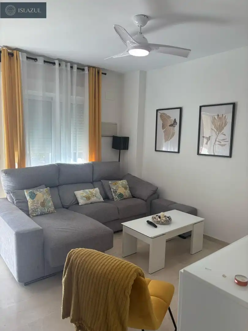 Sala d'estar de Casa adosada en venda en Isla Cristina amb Aire condicionat, Calefacció i Jardí privat