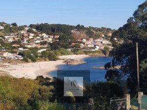 Vista exterior de Casa adosada en venda en Cangas  amb Jardí privat, Traster i Moblat