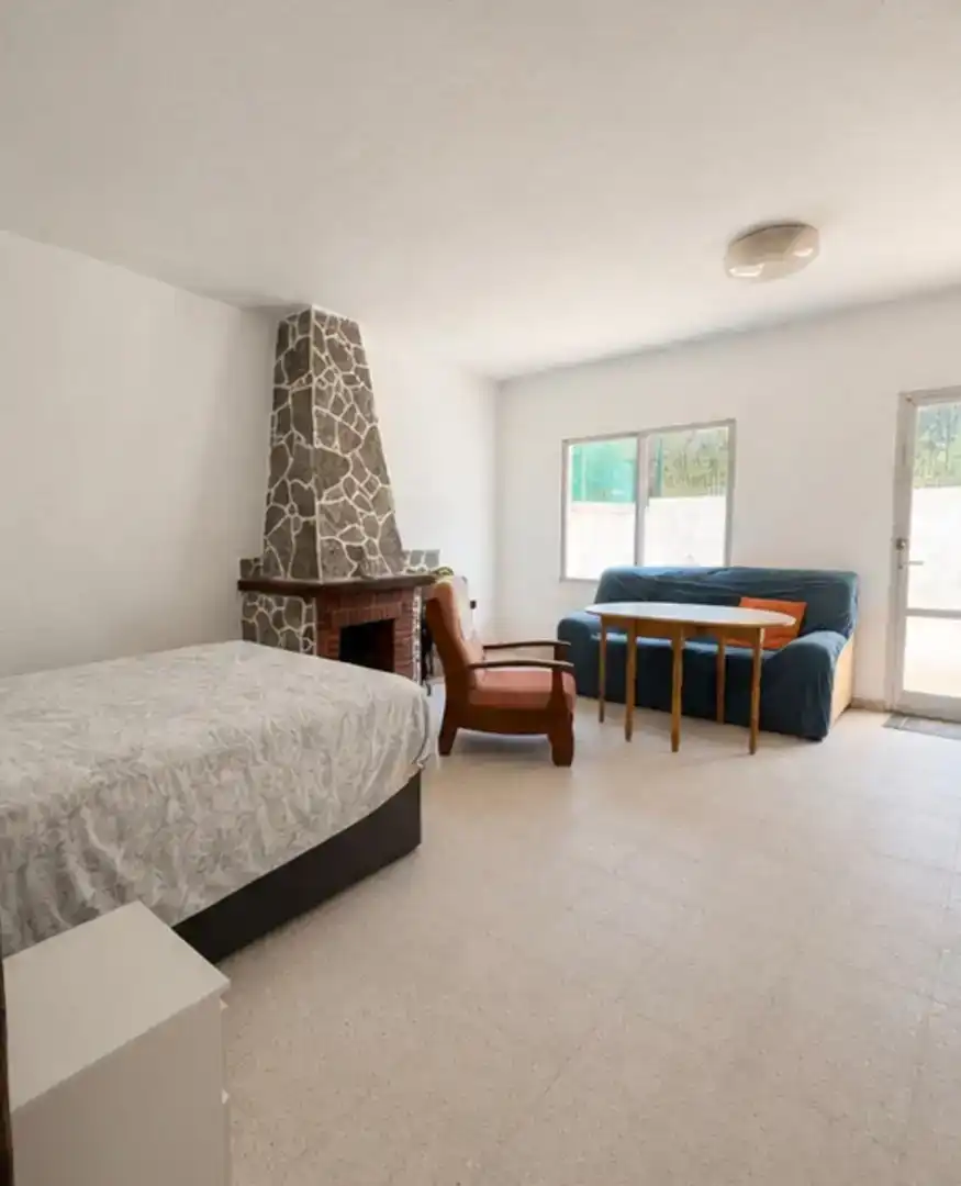 Sala d'estar de Casa adosada en venda en Es Castell amb Aire condicionat, Traster i Moblat