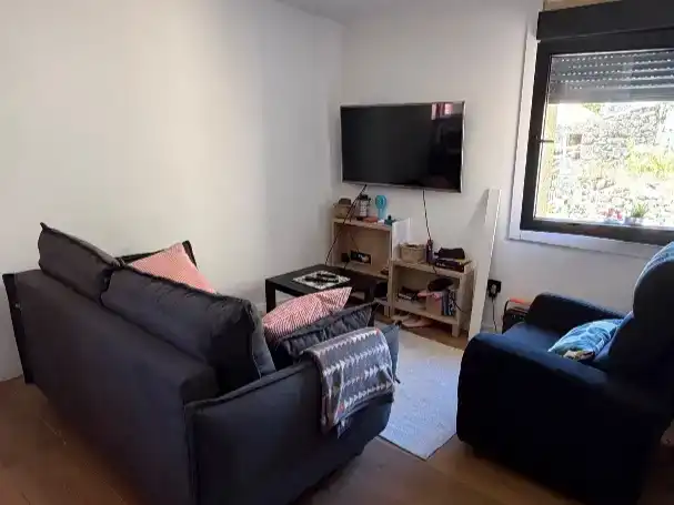 Sala d'estar de Casa adosada en venda en Oia amb Aire condicionat