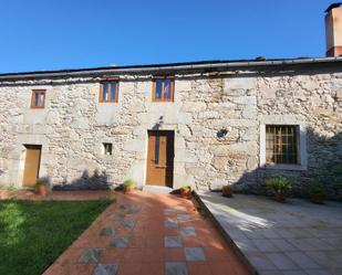 Exterior view of Single-family semi-detached for sale in Ourol  with Private garden, Storage room and Furnished