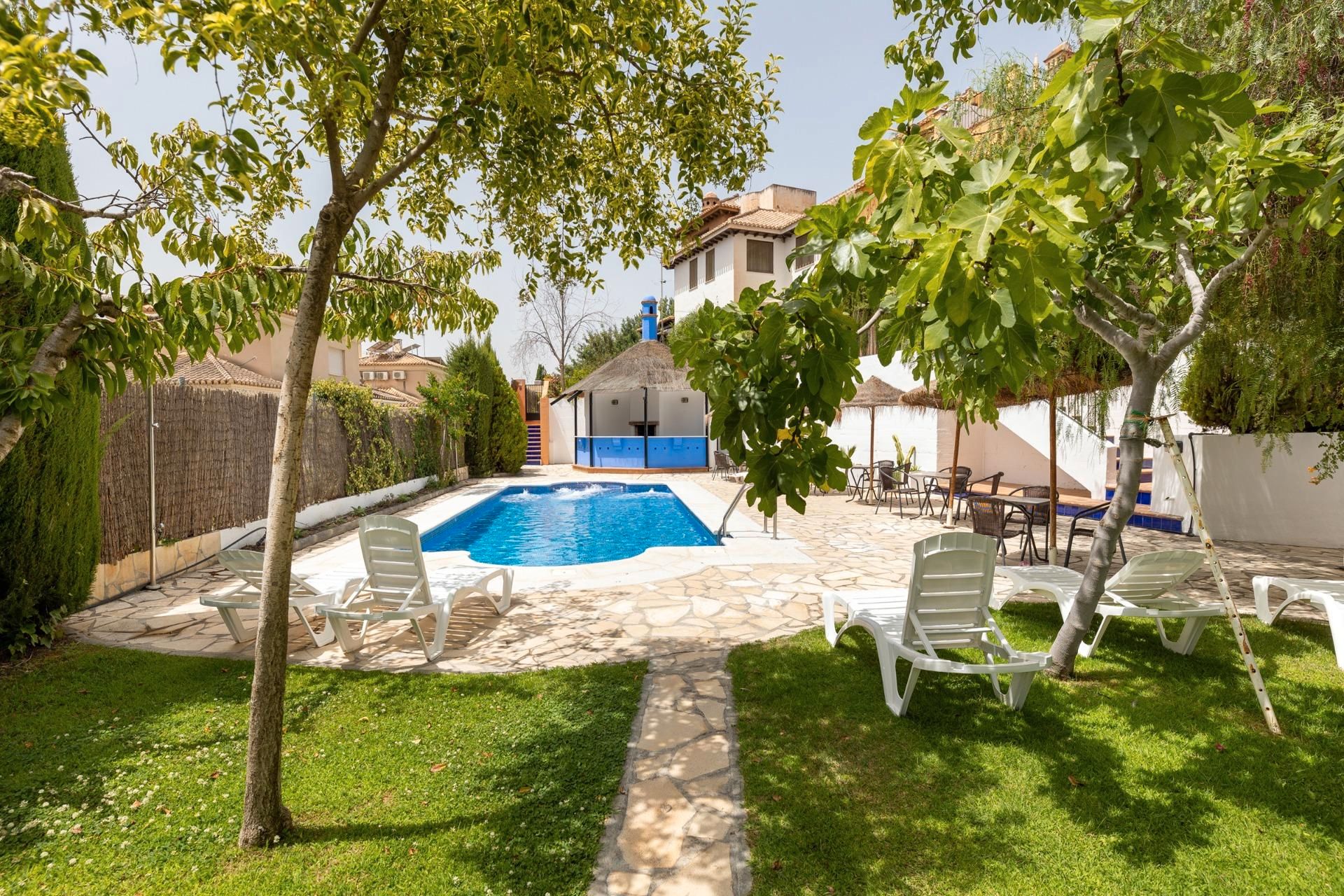 Swimming pool of Single-family semi-detached for sale in  Granada Capital  with Heating, Terrace and Community pool