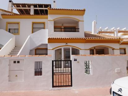 Vista exterior de Casa adosada en venda en Oliva amb Aire condicionat, Terrassa i Piscina