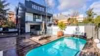Swimming pool of Single-family semi-detached for sale in  Madrid Capital  with Swimming Pool